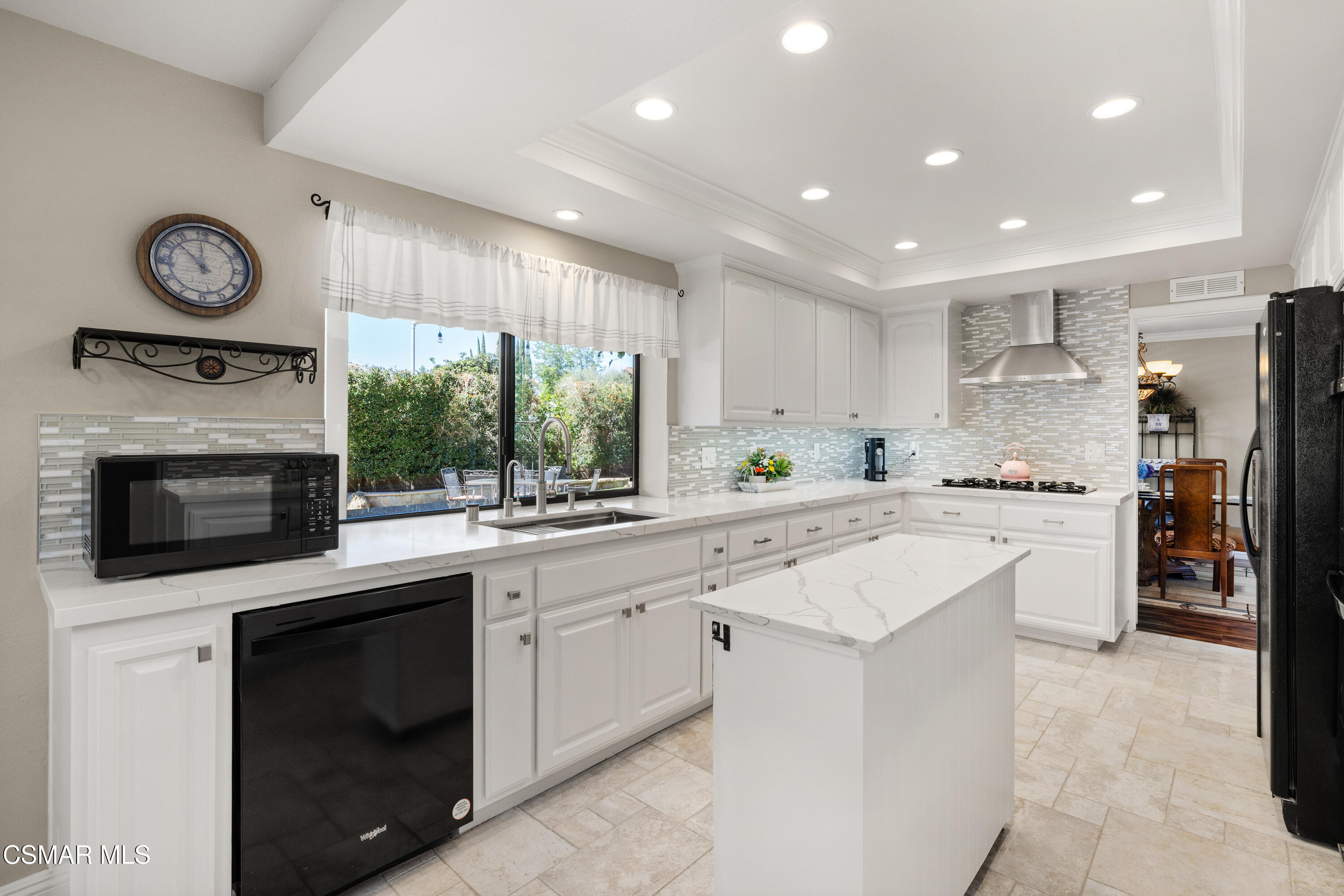 2489 North Greensward Street Simi Valley, CA 93065 - Photo 12 of 37 a kitchen with a stove top oven sink and cabinets