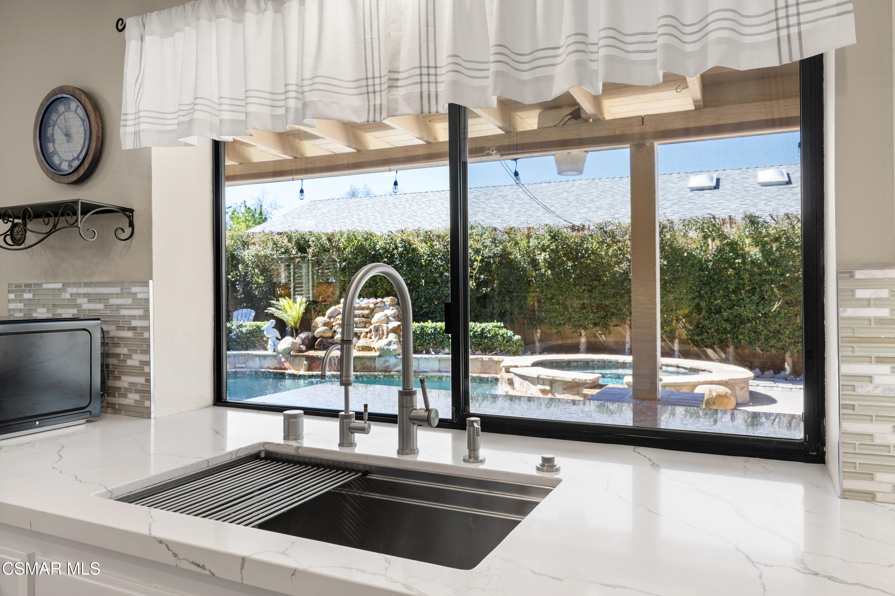 2489 North Greensward Street Simi Valley, CA 93065 - Photo 13 of 37 a view of a living room and floor to ceiling window or kitchen
