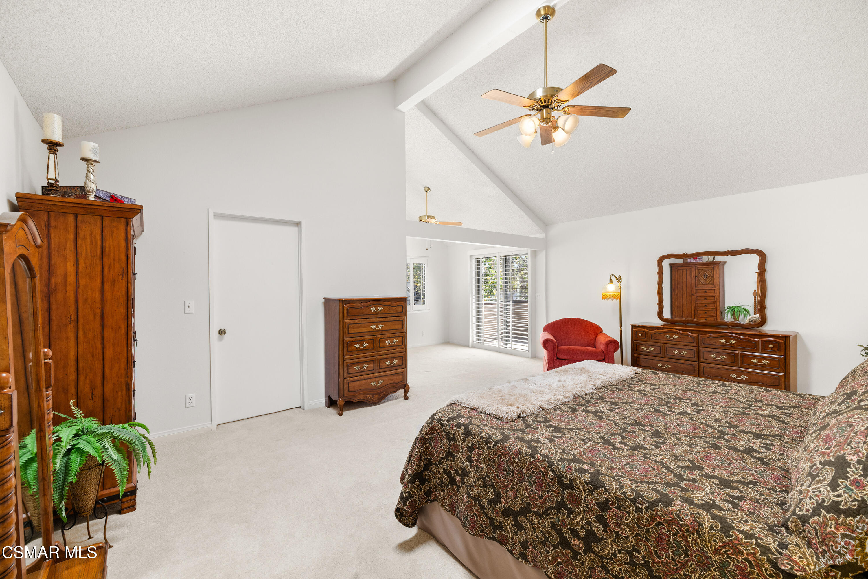 2489 North Greensward Street Simi Valley, CA 93065 - Photo 17 of 37 a bedroom with a bed and a chandelier