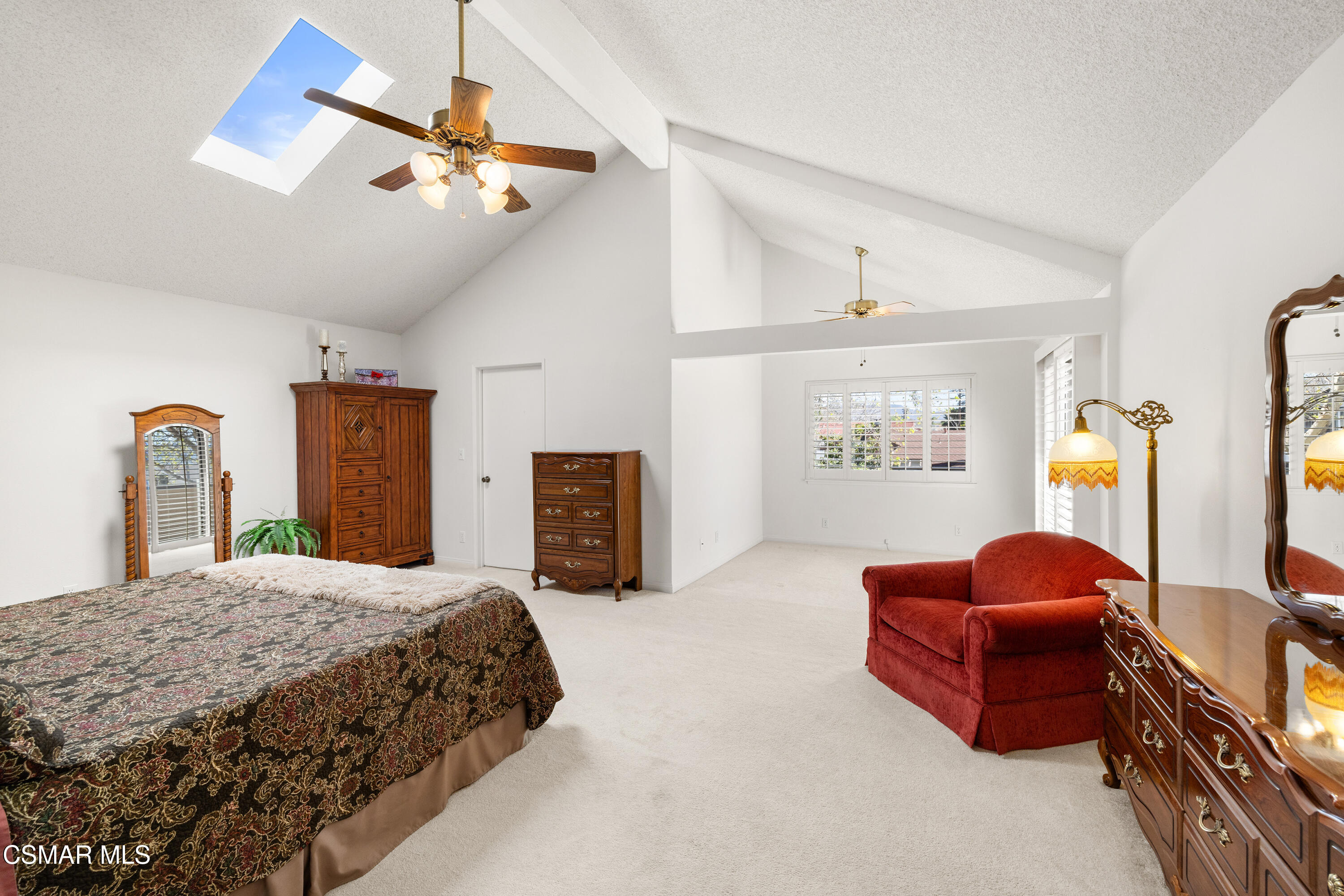 2489 North Greensward Street Simi Valley, CA 93065 - Photo 19 of 37 a bedroom with a bed and ceiling chandelier