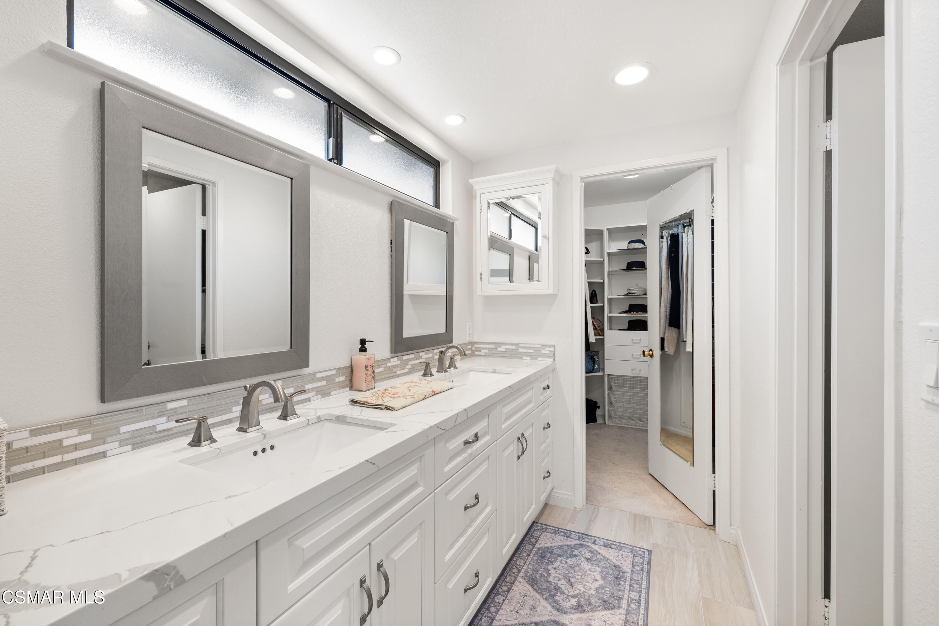 2489 North Greensward Street Simi Valley, CA 93065 - Photo 21 of 37 a spacious bathroom with a double vanity sink mirror and double