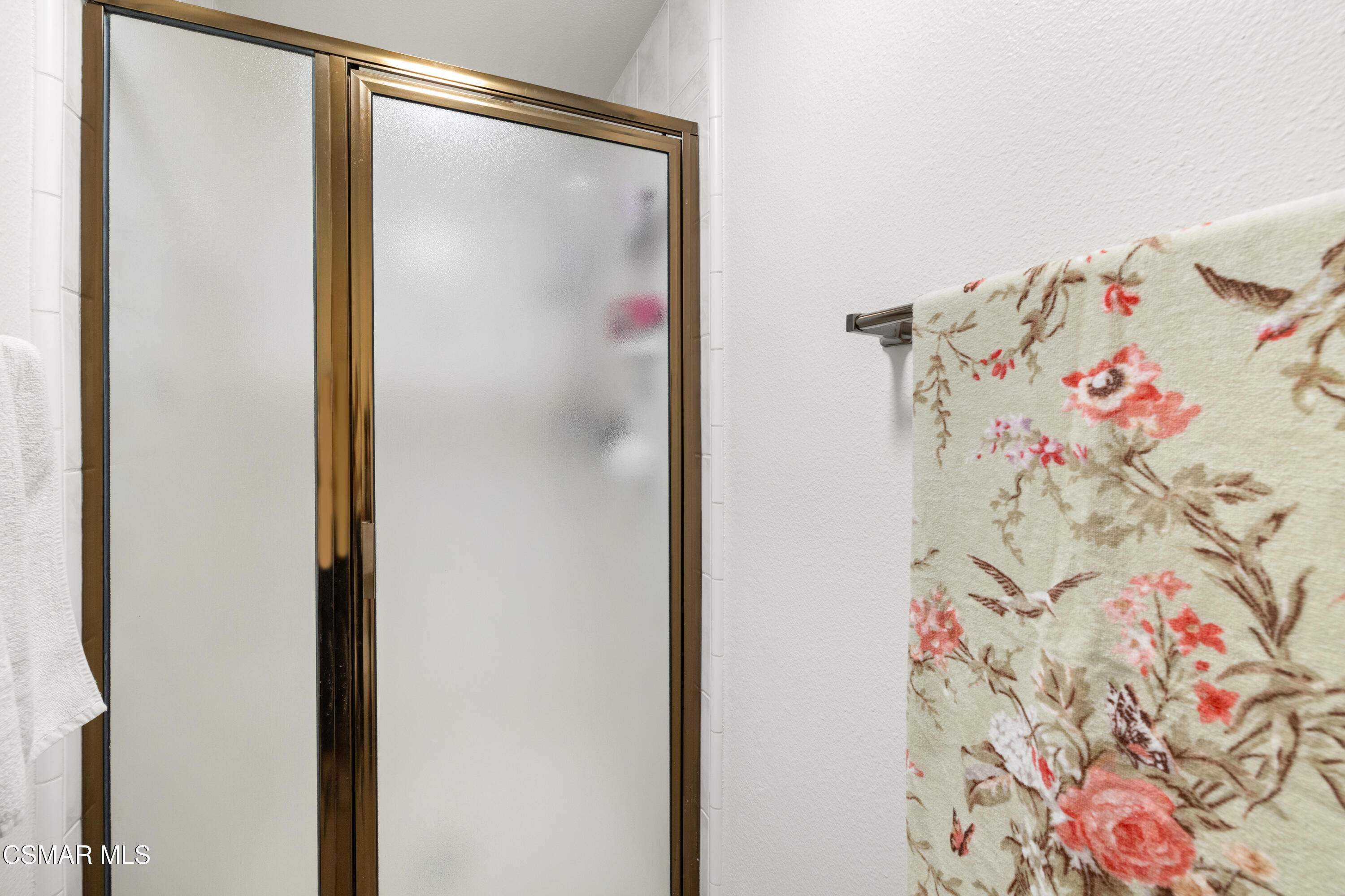 2489 North Greensward Street Simi Valley, CA 93065 - Photo 22 of 37 a bathroom with a bathtub and a shower curtain