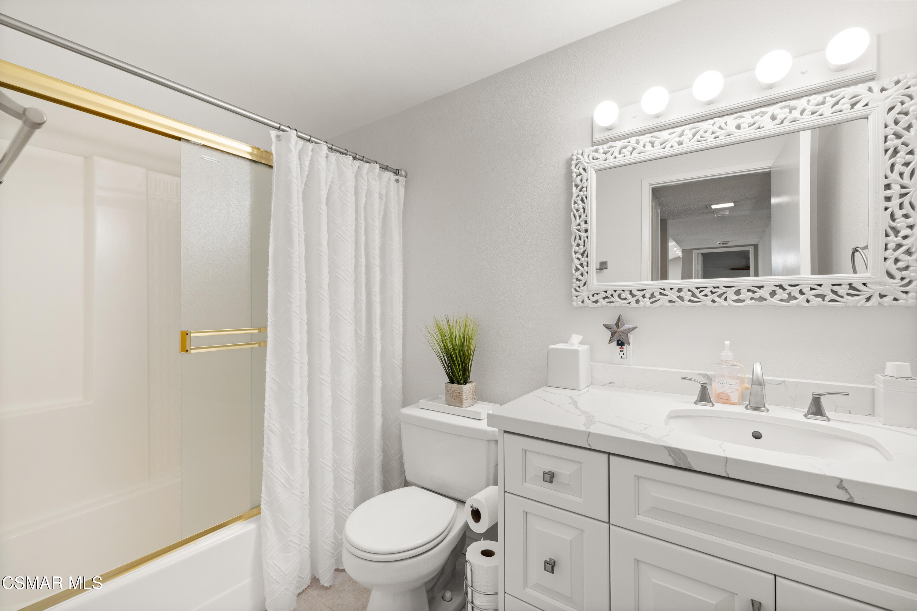 2489 North Greensward Street Simi Valley, CA 93065 - Photo 26 of 37 a bathroom with a sink a mirror a toilet and a shower