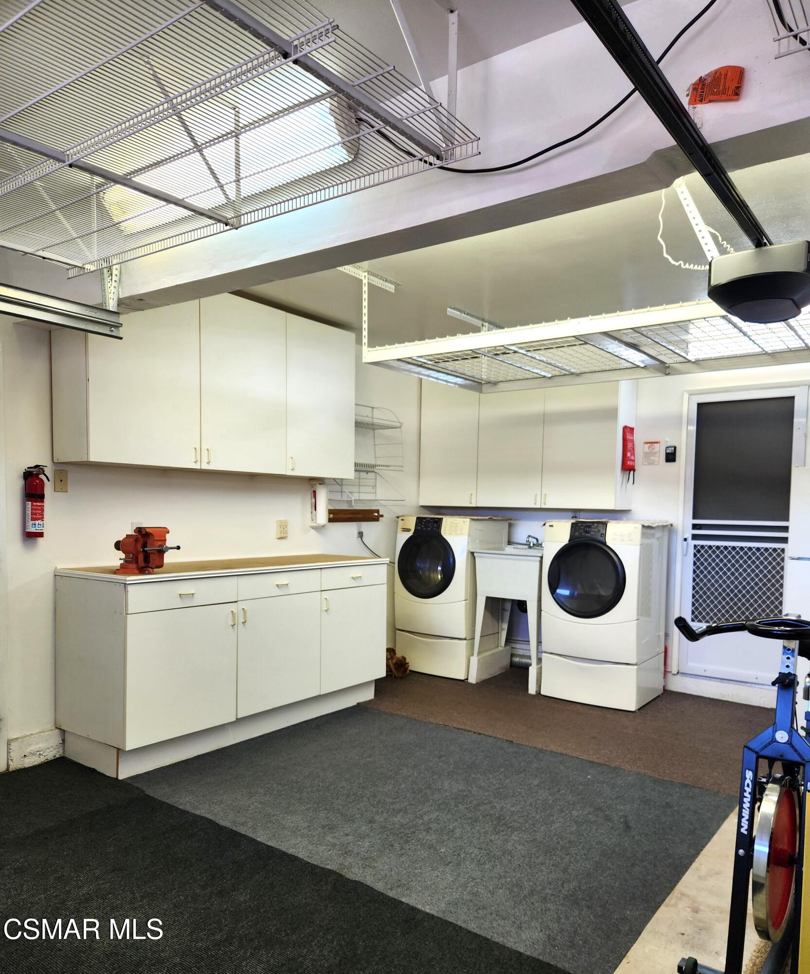 2489 North Greensward Street Simi Valley, CA 93065 - Photo 32 of 37 a kitchen with a stove and white cabinets