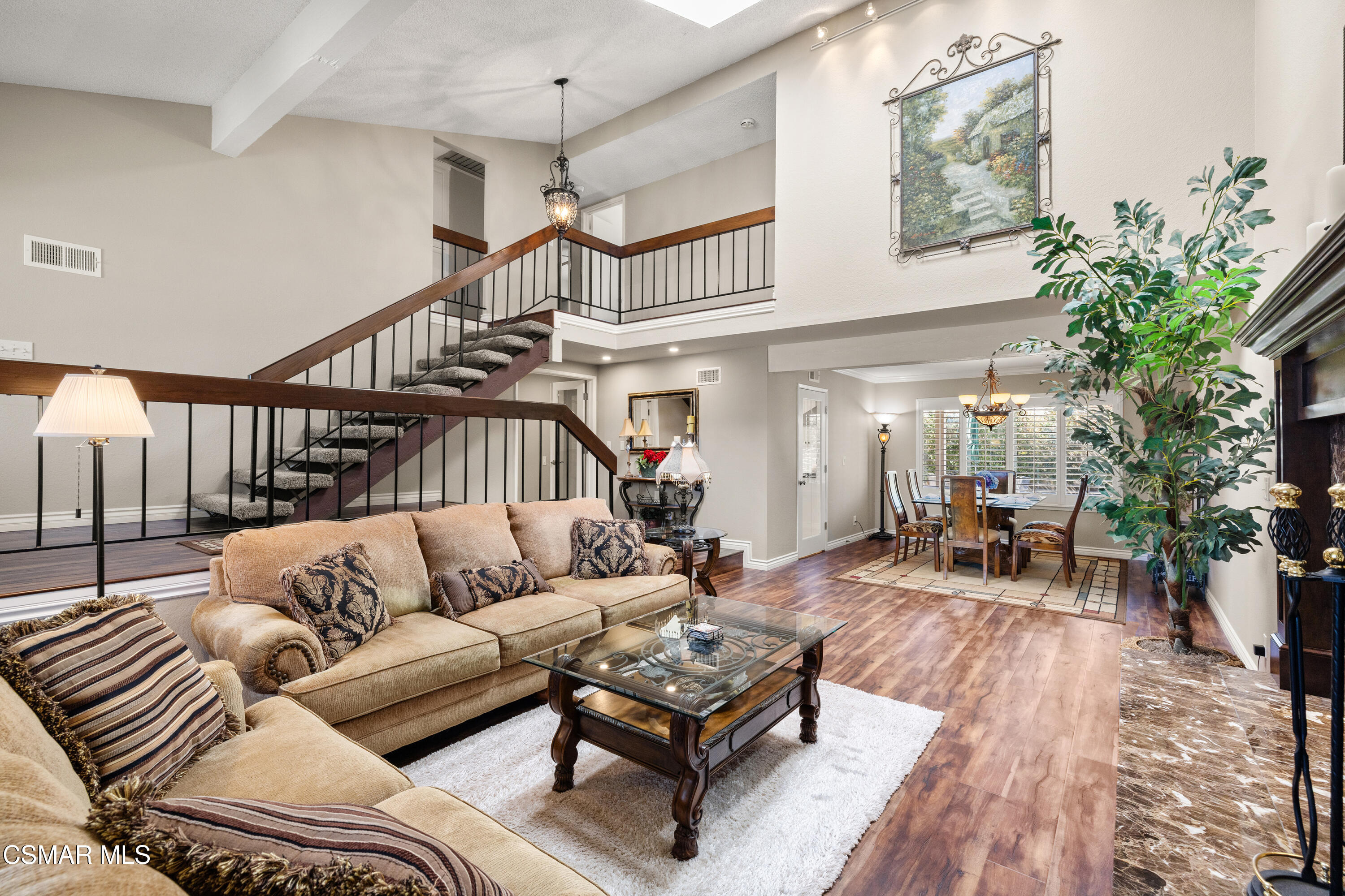 2489 North Greensward Street Simi Valley, CA 93065 - Photo 5 of 37 a living room with furniture a table and a potted plant