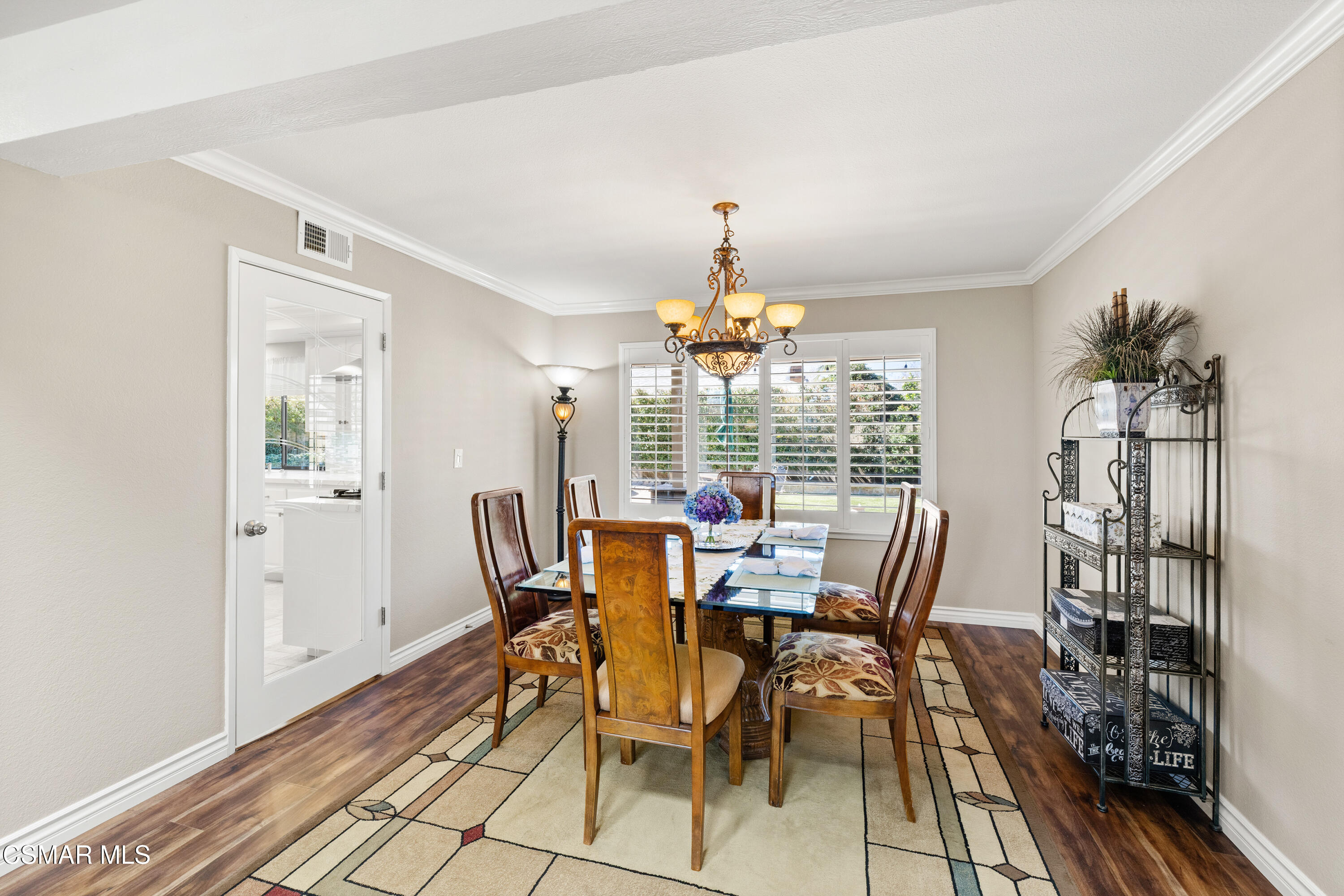 2489 North Greensward Street Simi Valley, CA 93065 - Photo 7 of 37 a view of a dining room with furniture wooden floor and chandelier