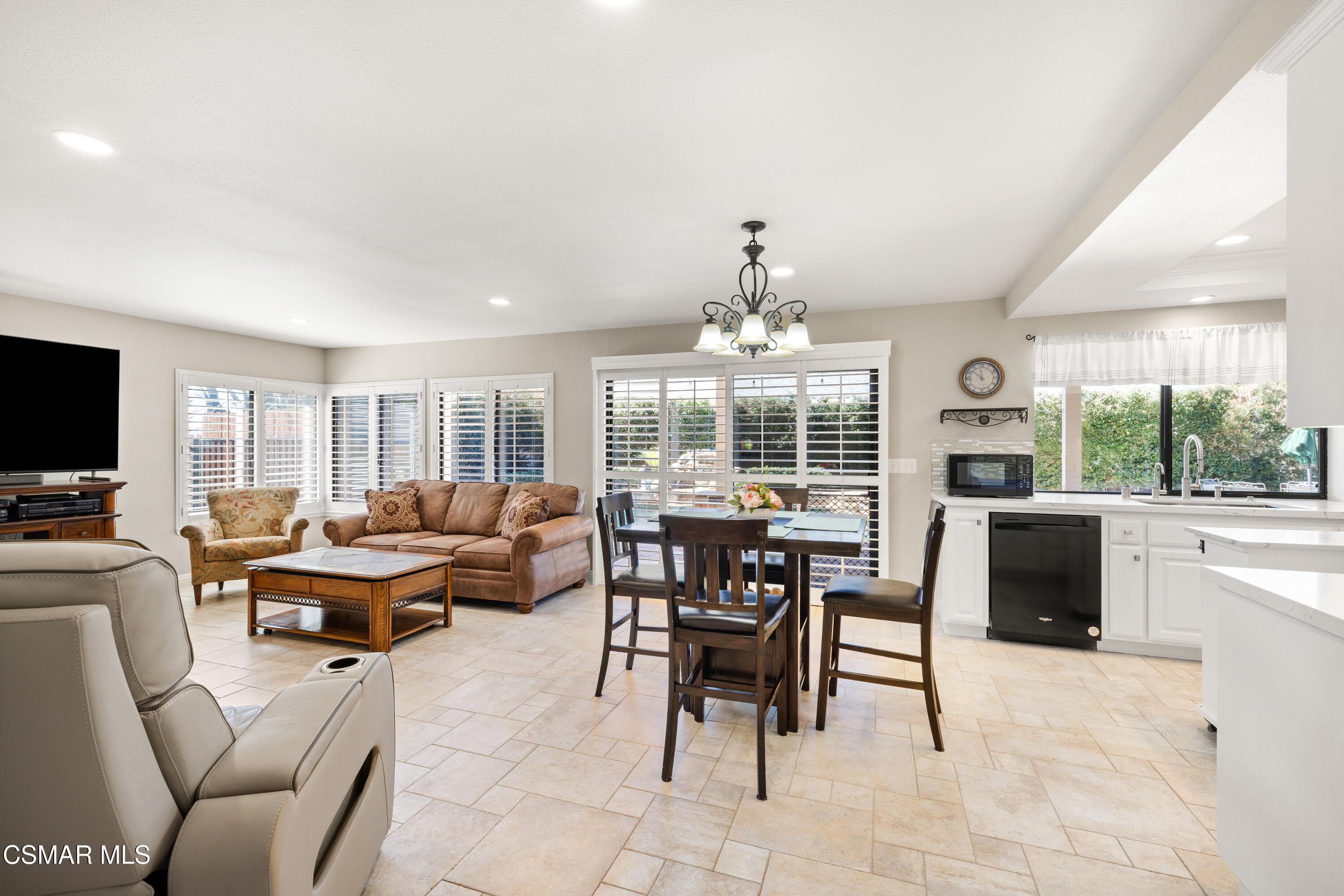 2489 North Greensward Street Simi Valley, CA 93065 - Photo 9 of 37 a living room with furniture chandelier and a large window