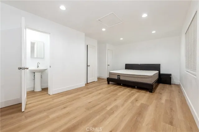 a view of a room with wooden floor and window