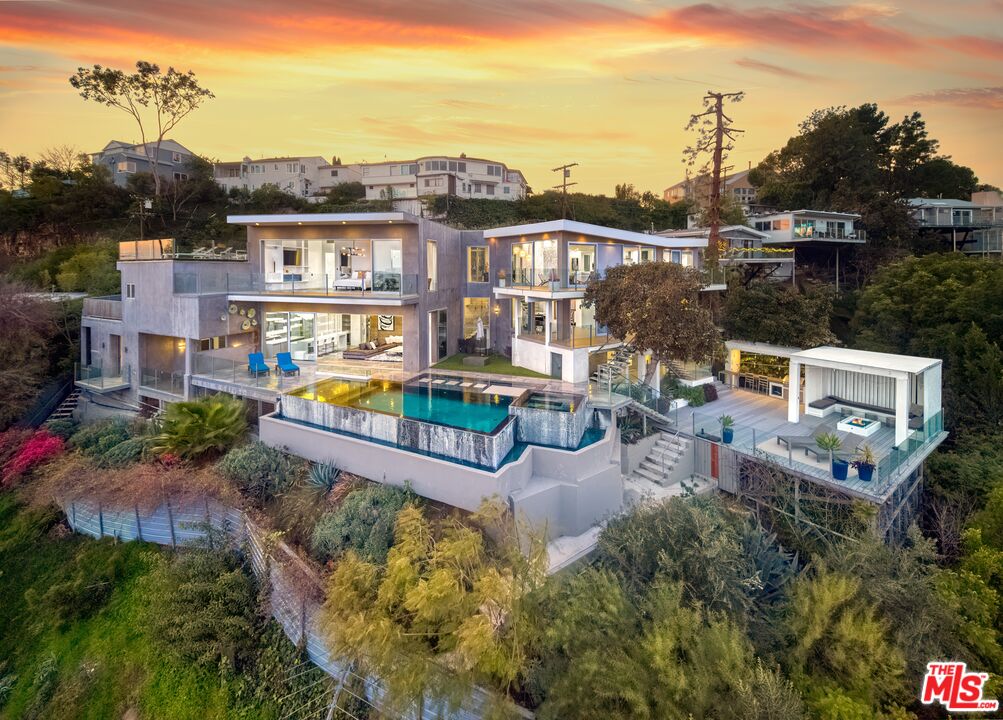 2500 Vasanta Way Los Angeles, CA 90068 - Photo 2 of 22 an aerial view of a house with garden space ocean and trees in the background