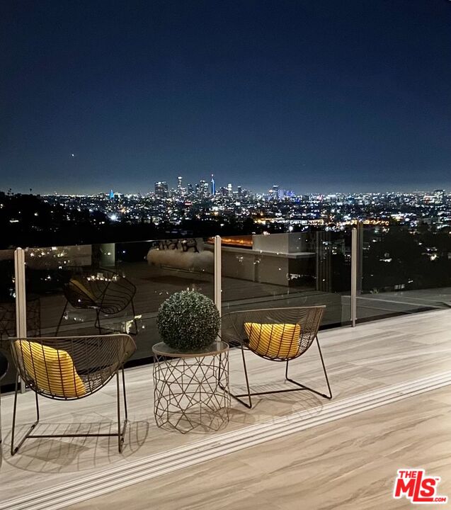 2500 Vasanta Way Los Angeles, CA 90068 - Photo 8 of 22 a terrace with outdoor seating and city view