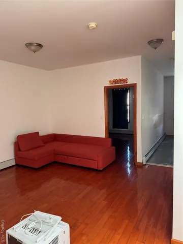 a room with furniture and wooden floor