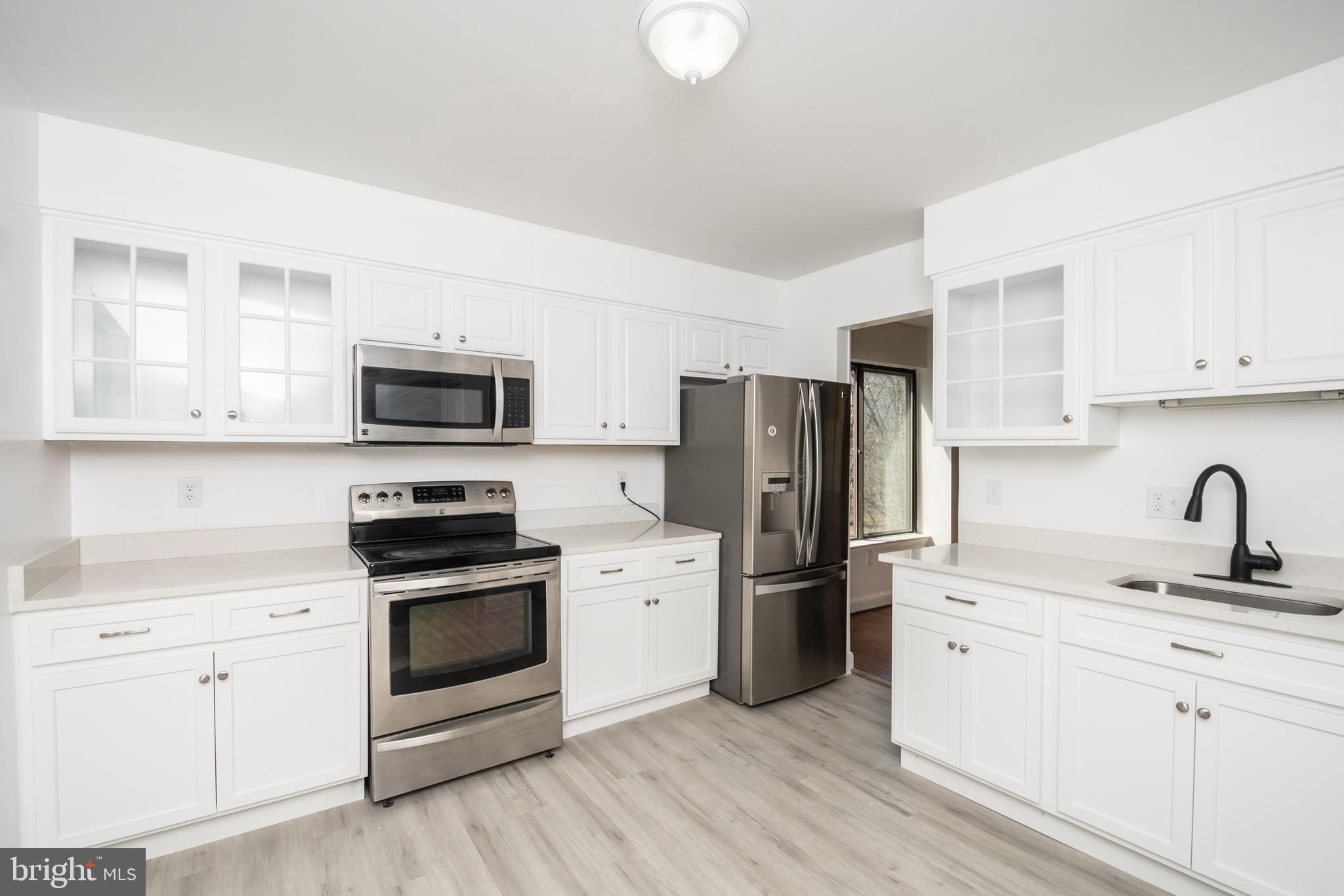 9069 Centerway Road Gaithersburg, MD 20879 - Photo 8 of 37 kitchen with updated Quartz Countertop in 2022