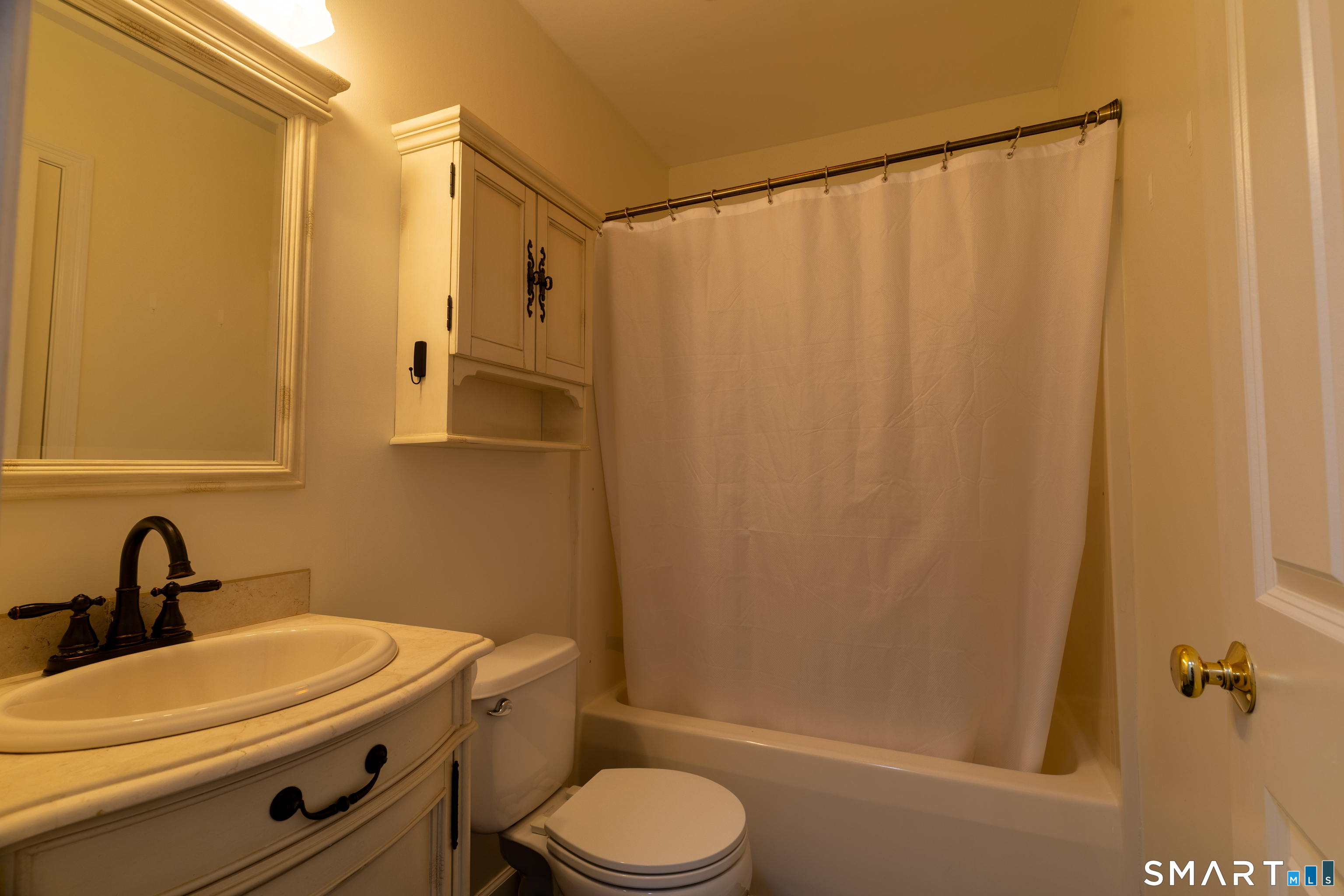 226 Noank Ledyard Road Groton, CT 06355 - Photo 17 of 26 a bathroom with a sink a toilet and shower