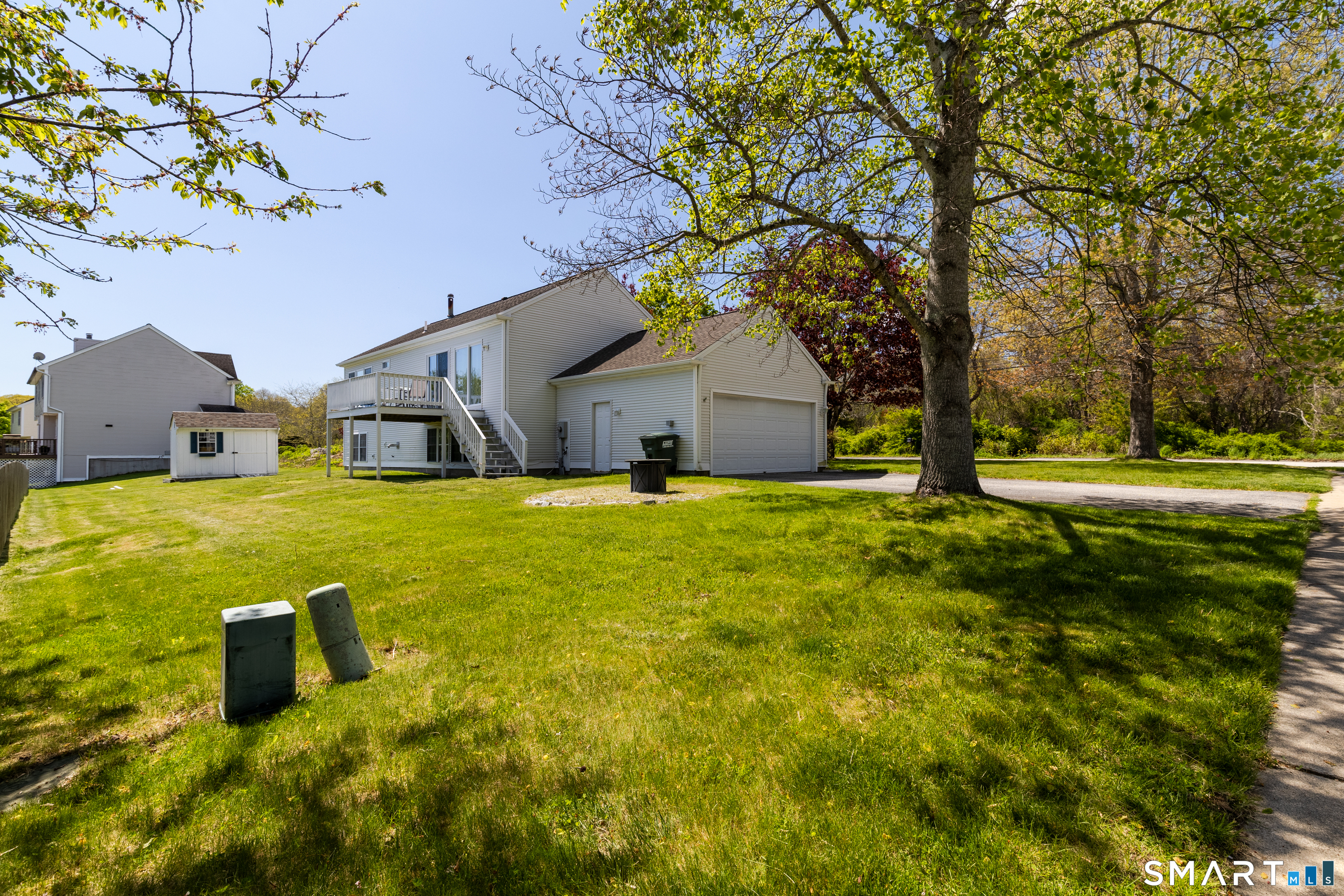 226 Noank Ledyard Road Groton, CT 06355 - Photo 21 of 26 a house view with a garden space