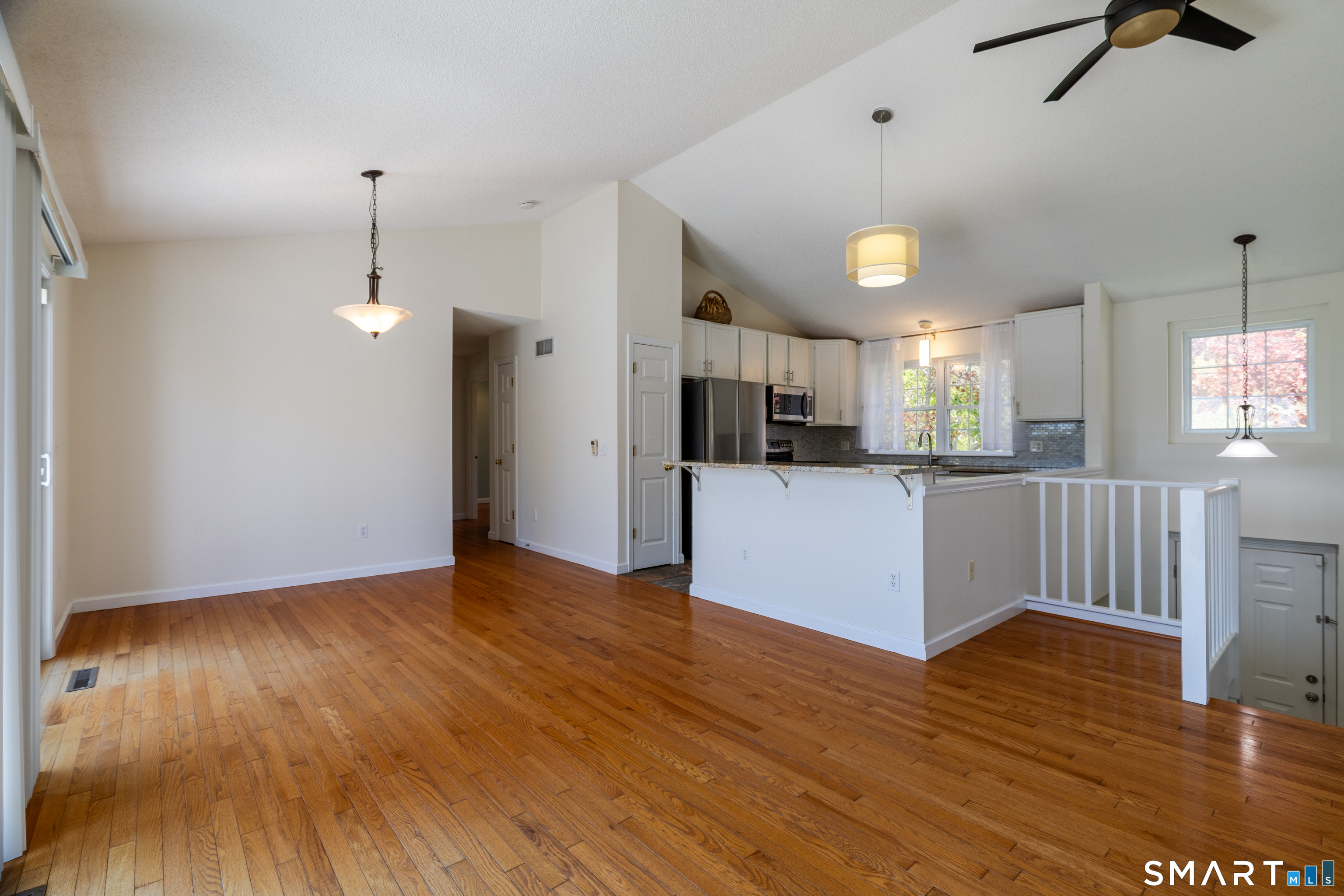 226 Noank Ledyard Road Groton, CT 06355 - Photo 5 of 26 a view of a kitchen with wooden floor and a kitchen