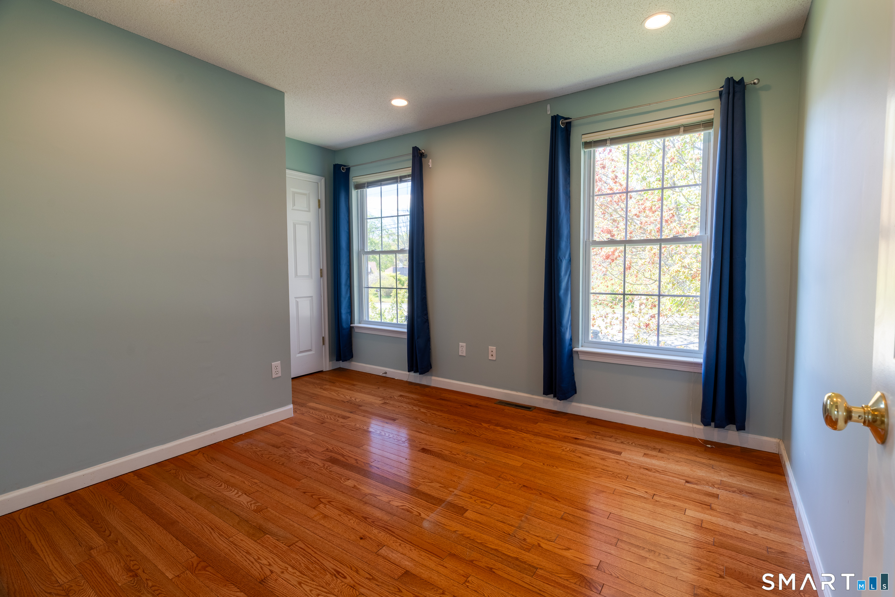 226 Noank Ledyard Road Groton, CT 06355 - Photo 10 of 26 a view of an empty room with wooden floor and a window