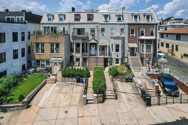 a view of multiple houses with a pathway
