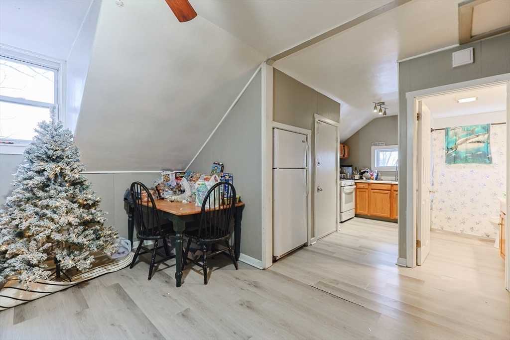 118 Maple Street Fall River, MA 02720 - Photo 14 of 36 a view of a dining room with furniture and a potted plant