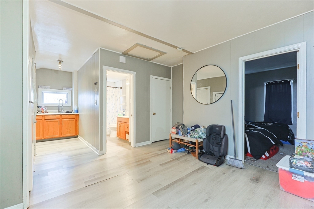 118 Maple Street Fall River, MA 02720 - Photo 15 of 36 a room with furniture and a mirror