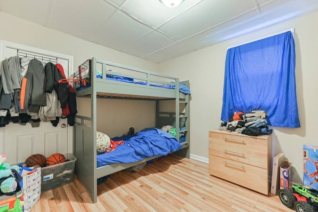 118 Maple Street Fall River, MA 02720 - Photo 19 of 36 a bedroom with a bed and a closet