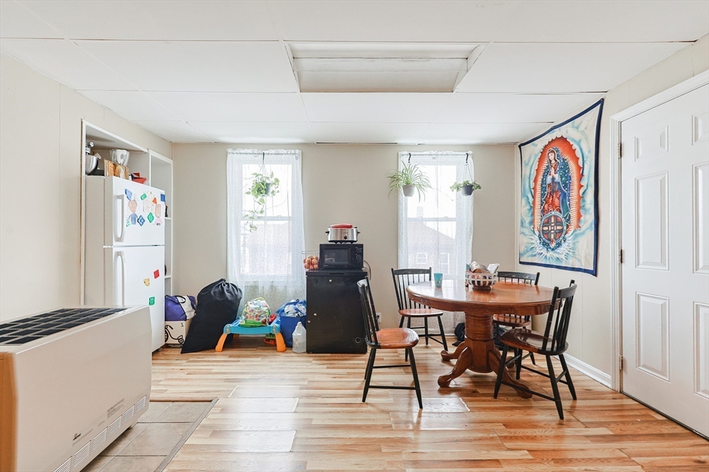 118 Maple Street Fall River, MA 02720 - Photo 22 of 36 a view of a dining room with furniture window and wooden floor