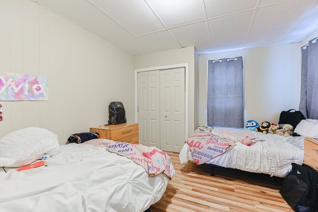 118 Maple Street Fall River, MA 02720 - Photo 25 of 36 a bedroom with a bed and a closet