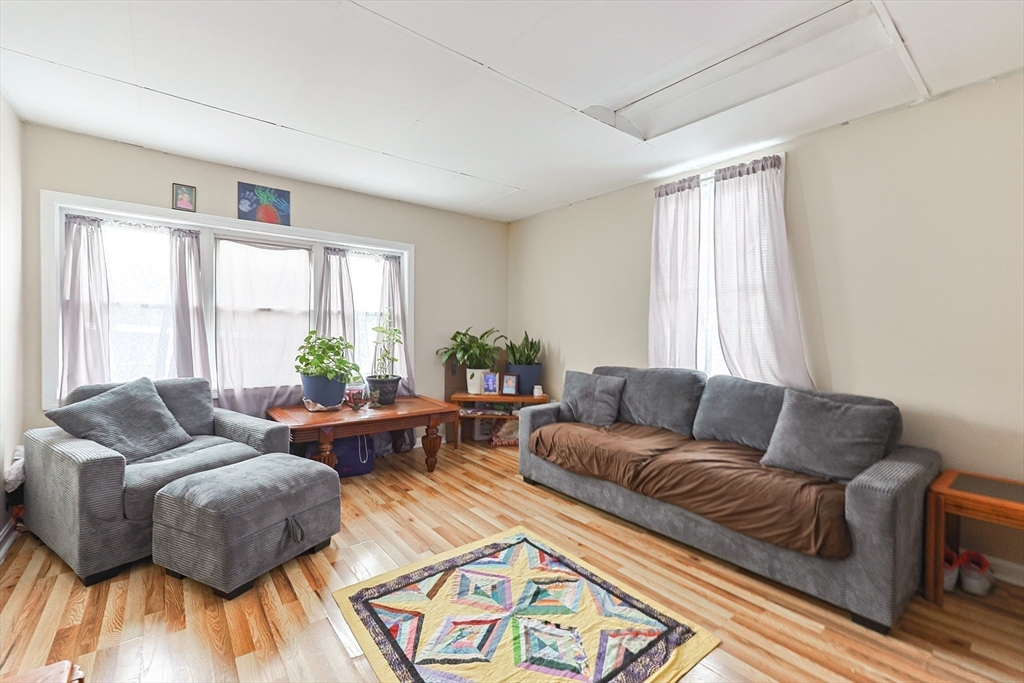 118 Maple Street Fall River, MA 02720 - Photo 28 of 36 a living room with furniture and a wooden floor