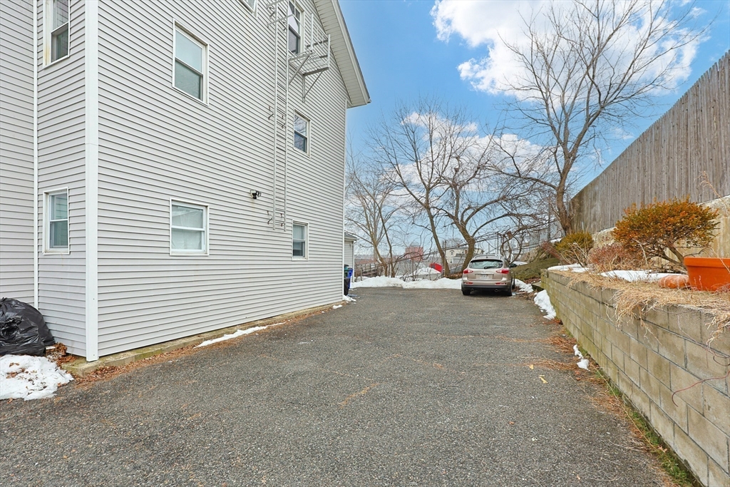 118 Maple Street Fall River, MA 02720 - Photo 34 of 36 a view of a house with a snow