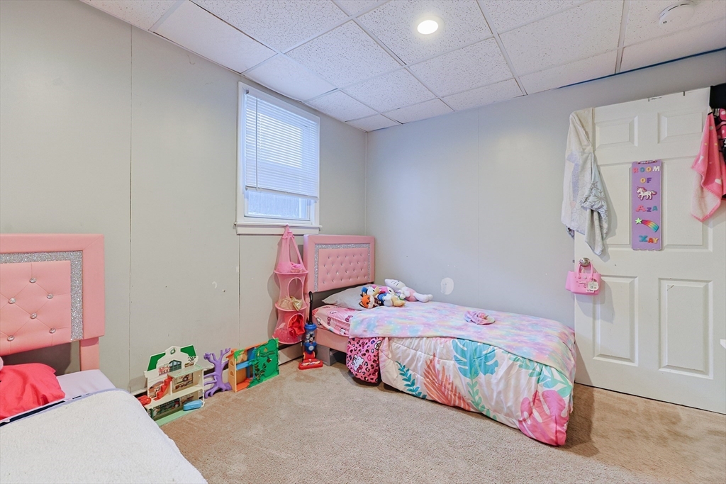 118 Maple Street Fall River, MA 02720 - Photo 9 of 36 a bedroom with a bed and a couch