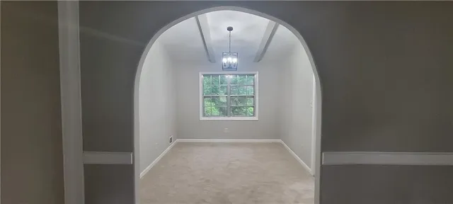 an entryway in a hallway with a window