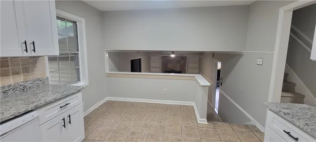 a view of a bathroom with a sink and mirror