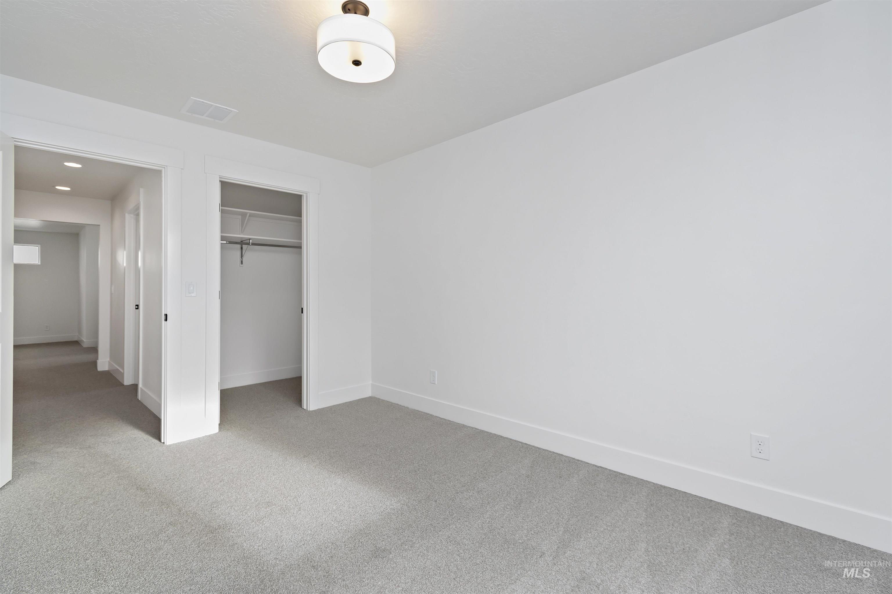 764 South Calhoun Lane Star, ID 83669 - Photo 34 of 48 Unfurnished bedroom with carpet flooring and baseboards