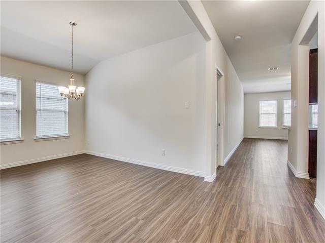 504 Brook View Court Anna, TX 75409 - Photo 2 of 10 a view of a room with wooden floor and window