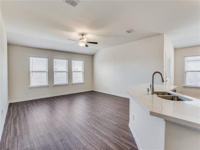 504 Brook View Court Anna, TX 75409 - Photo 4 of 10 a view of a kitchen with a sink and dishwasher with wooden floor