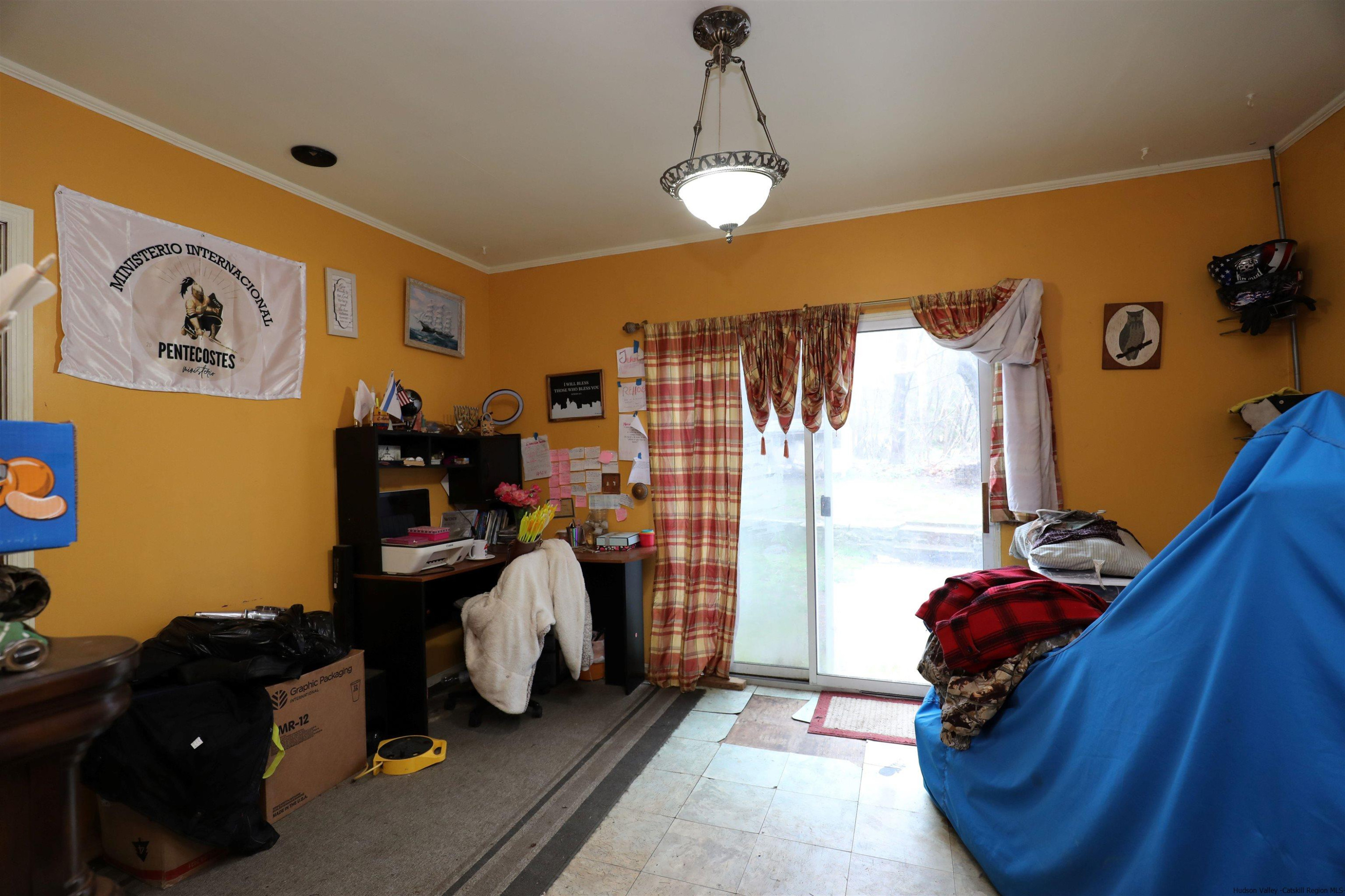 506 Plains Road Wallkill, NY 12589 - Photo 11 of 15 a living room with furniture and a window