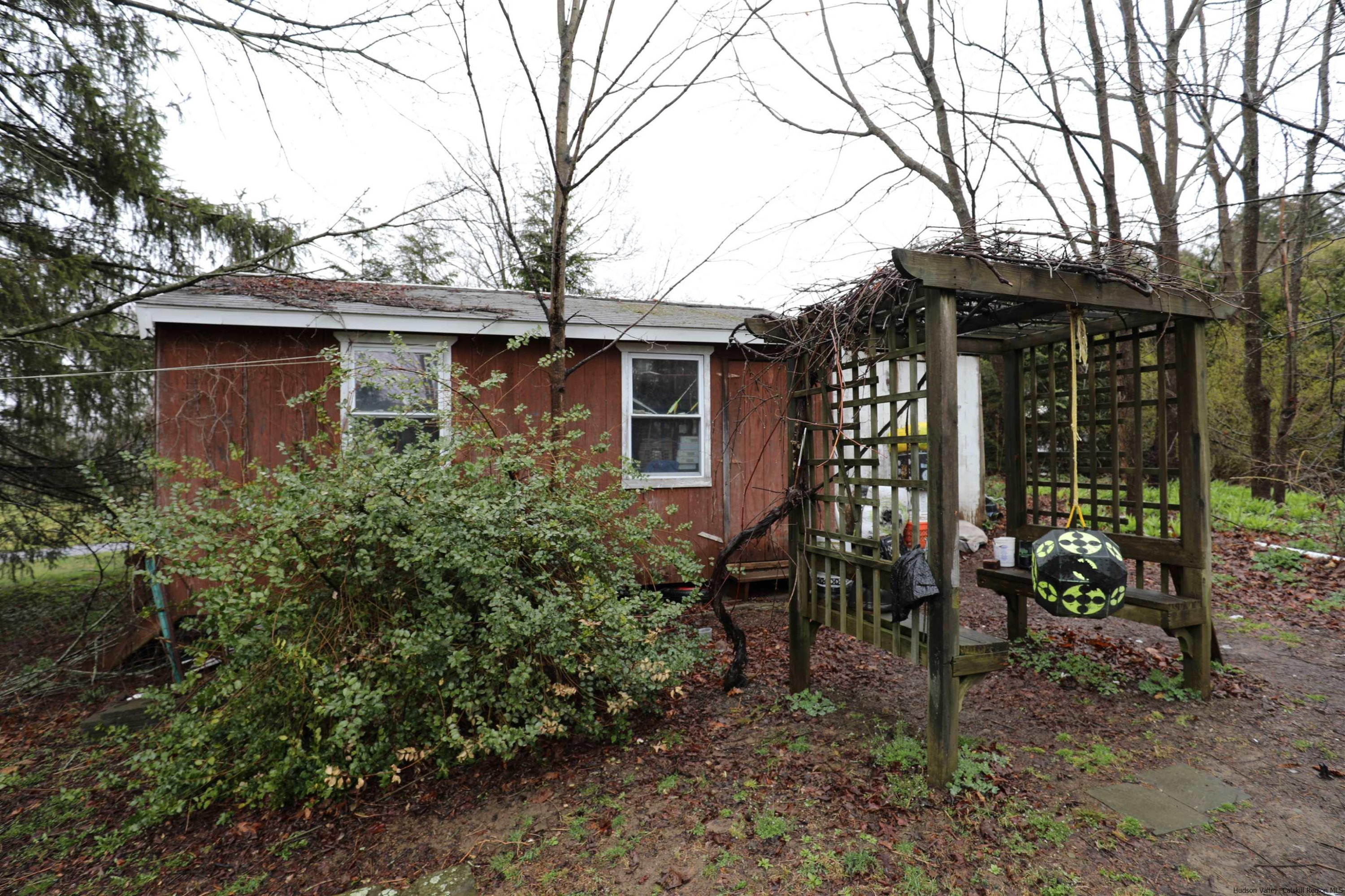 506 Plains Road Wallkill, NY 12589 - Photo 15 of 15 a view of a house with a yard and sitting area