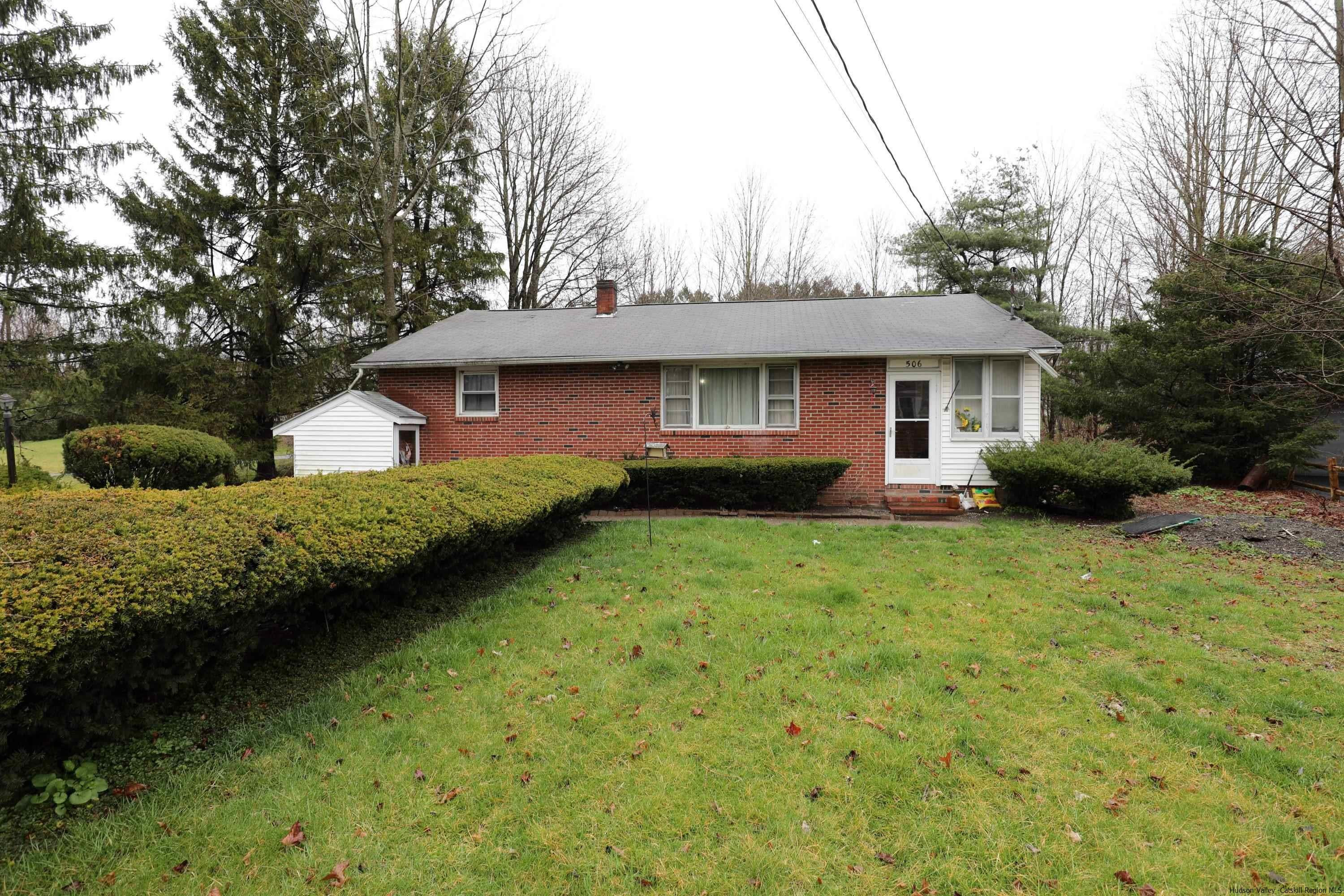 506 Plains Road Wallkill, NY 12589 - Photo 2 of 15 a front view of a house with garden