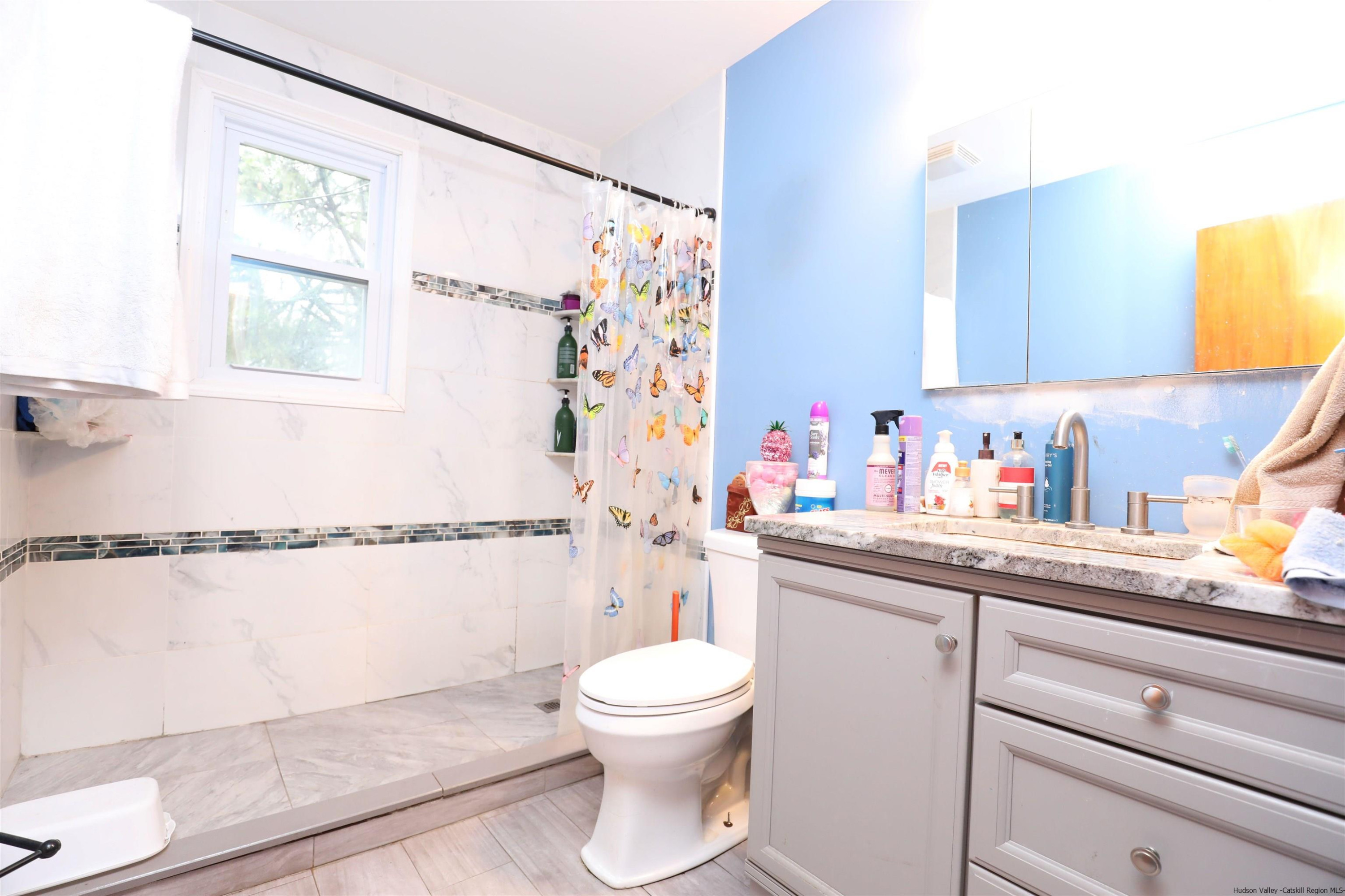 506 Plains Road Wallkill, NY 12589 - Photo 4 of 15 a bathroom with a sink toilet and shower