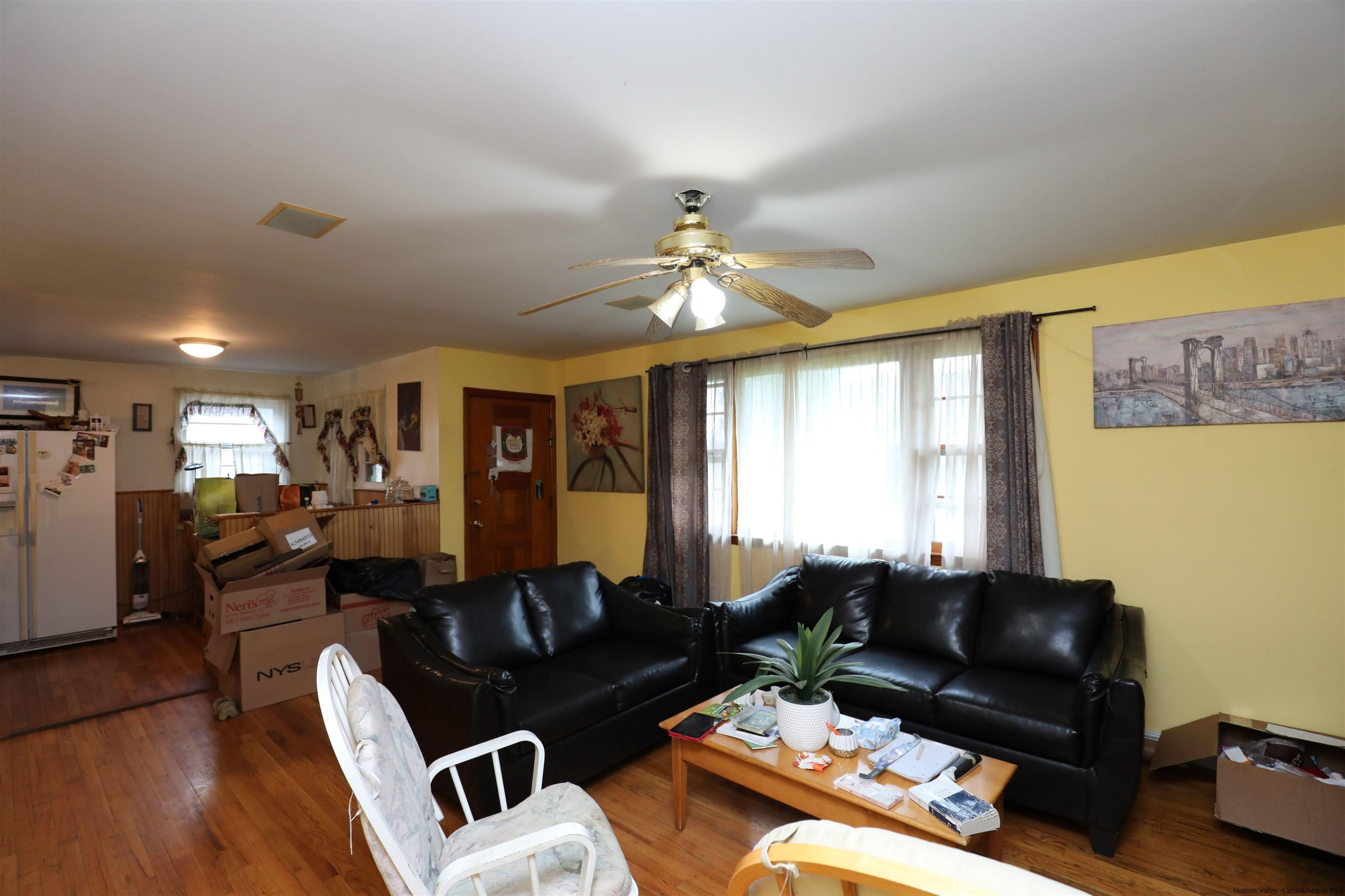 506 Plains Road Wallkill, NY 12589 - Photo 8 of 15 a living room with furniture and a flat screen tv