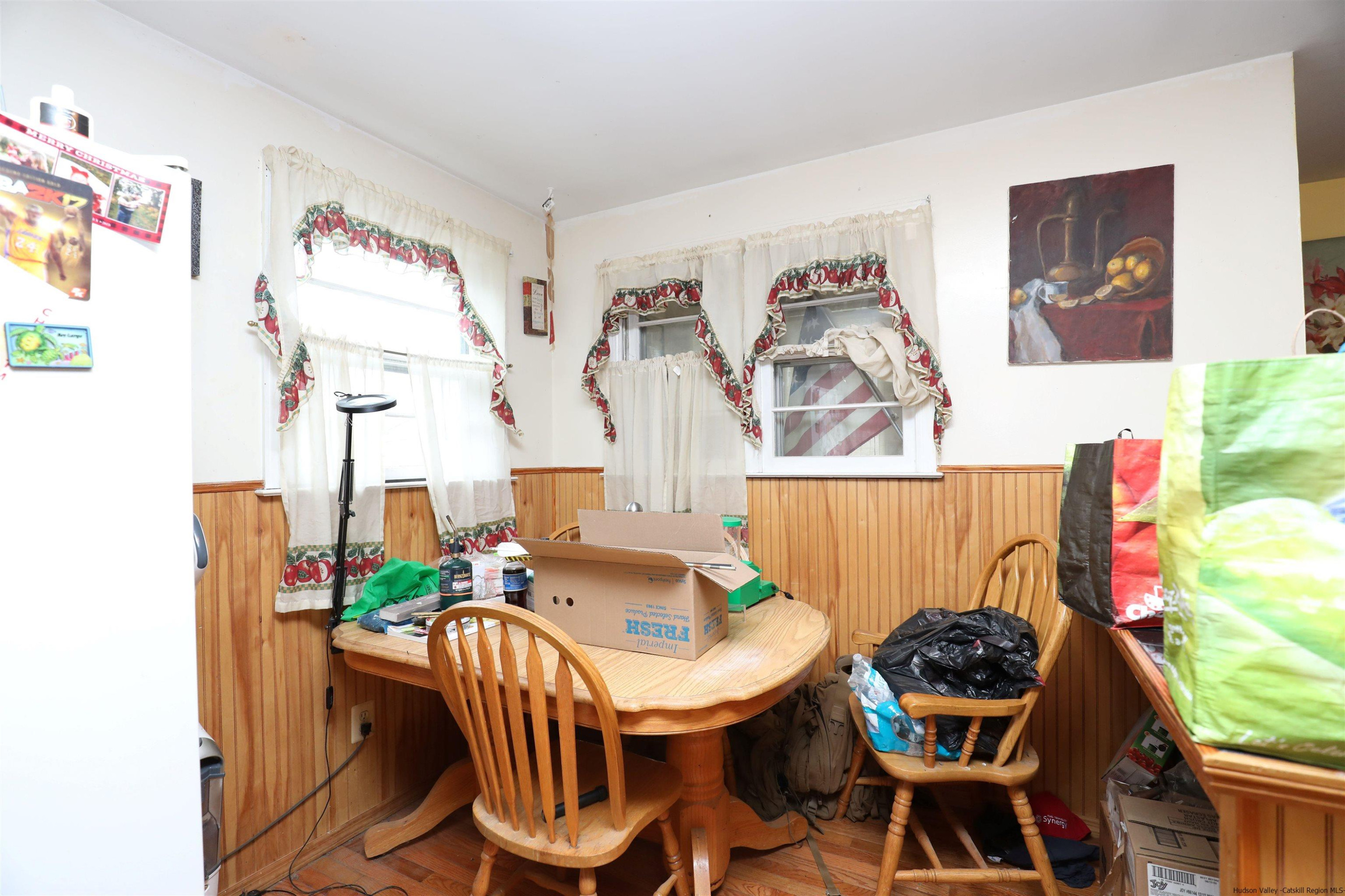 506 Plains Road Wallkill, NY 12589 - Photo 9 of 15 a dining room with furniture and a potted plant