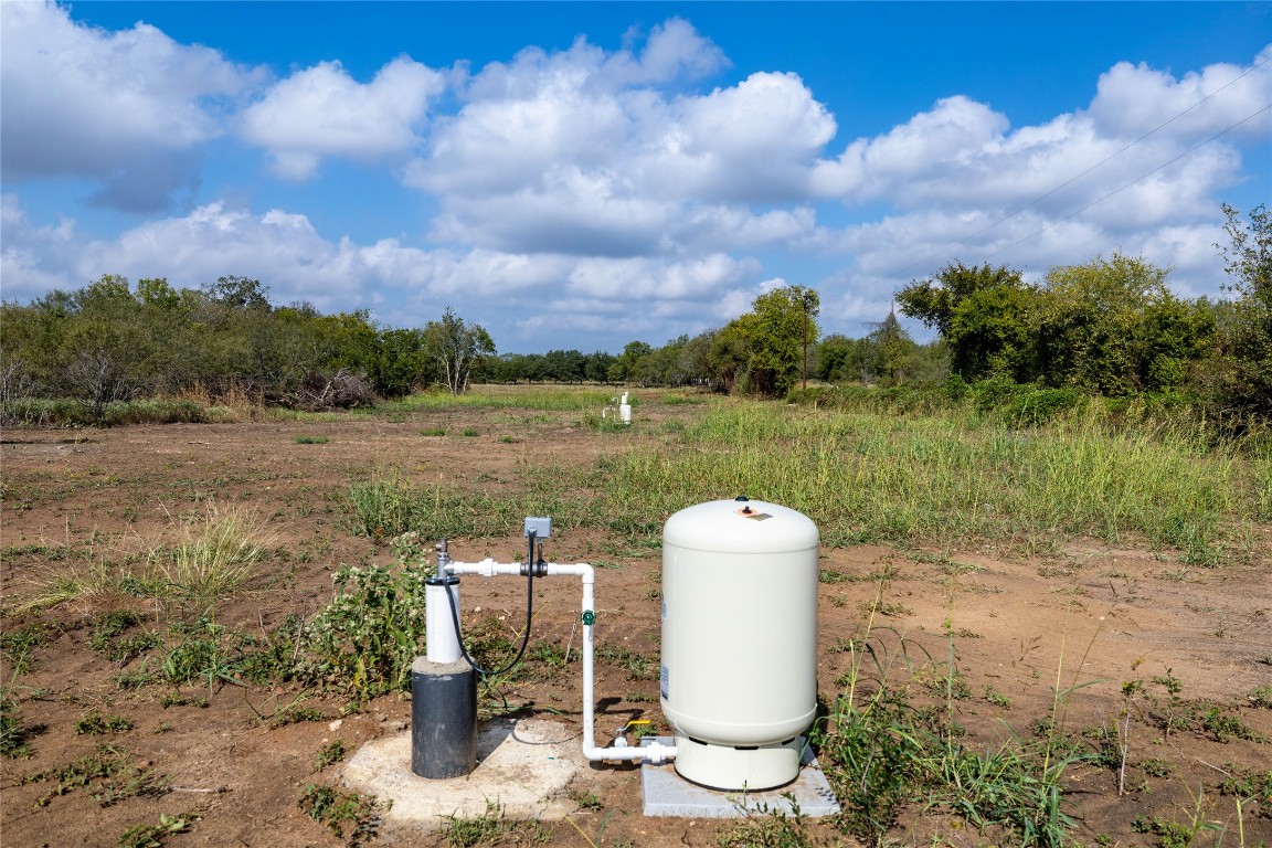 a view of a fountain in a yard with a fountain