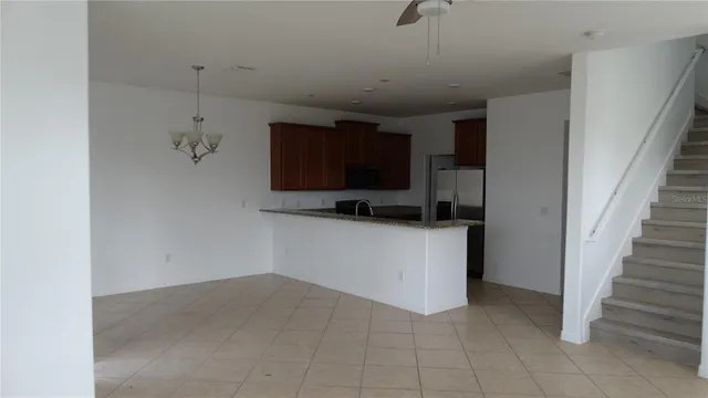 a view of a kitchen with a sink and dishwasher kitchen appliances