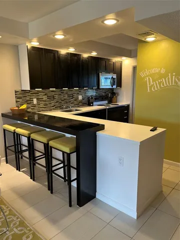 a bathroom with a sink toilet and mirror