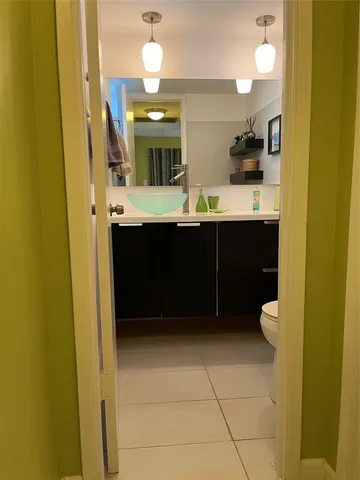 a view of a refrigerator in kitchen