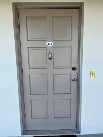 a view of open kitchen with seating area