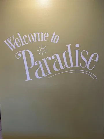 a kitchen with a table and chairs in it