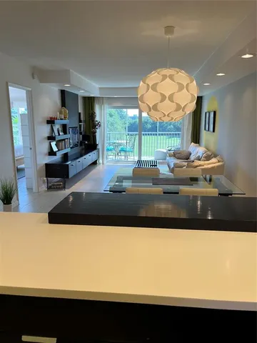 a bathroom with a sink vanity and a mirror
