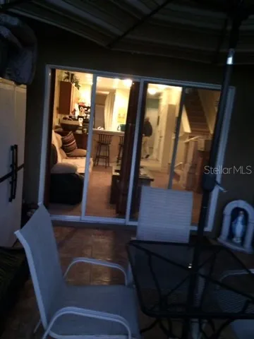 a view of living room with furniture and a flat screen tv