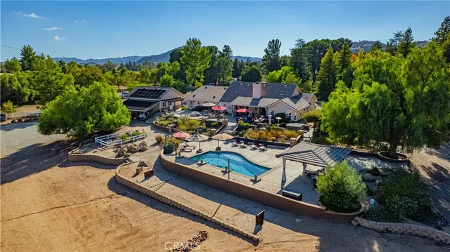 a view of a chairs and table in a patio