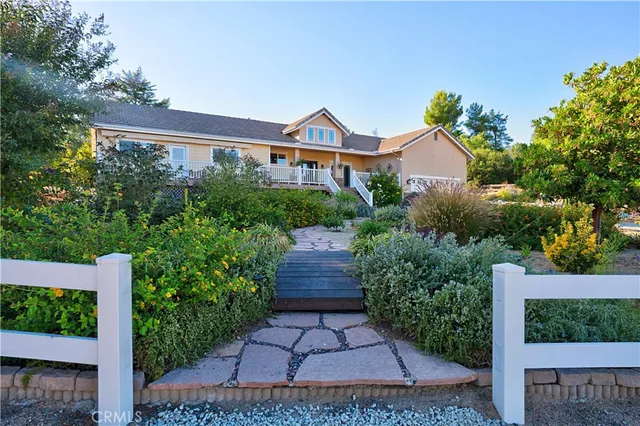 a living room with furniture ceiling fan and a rug